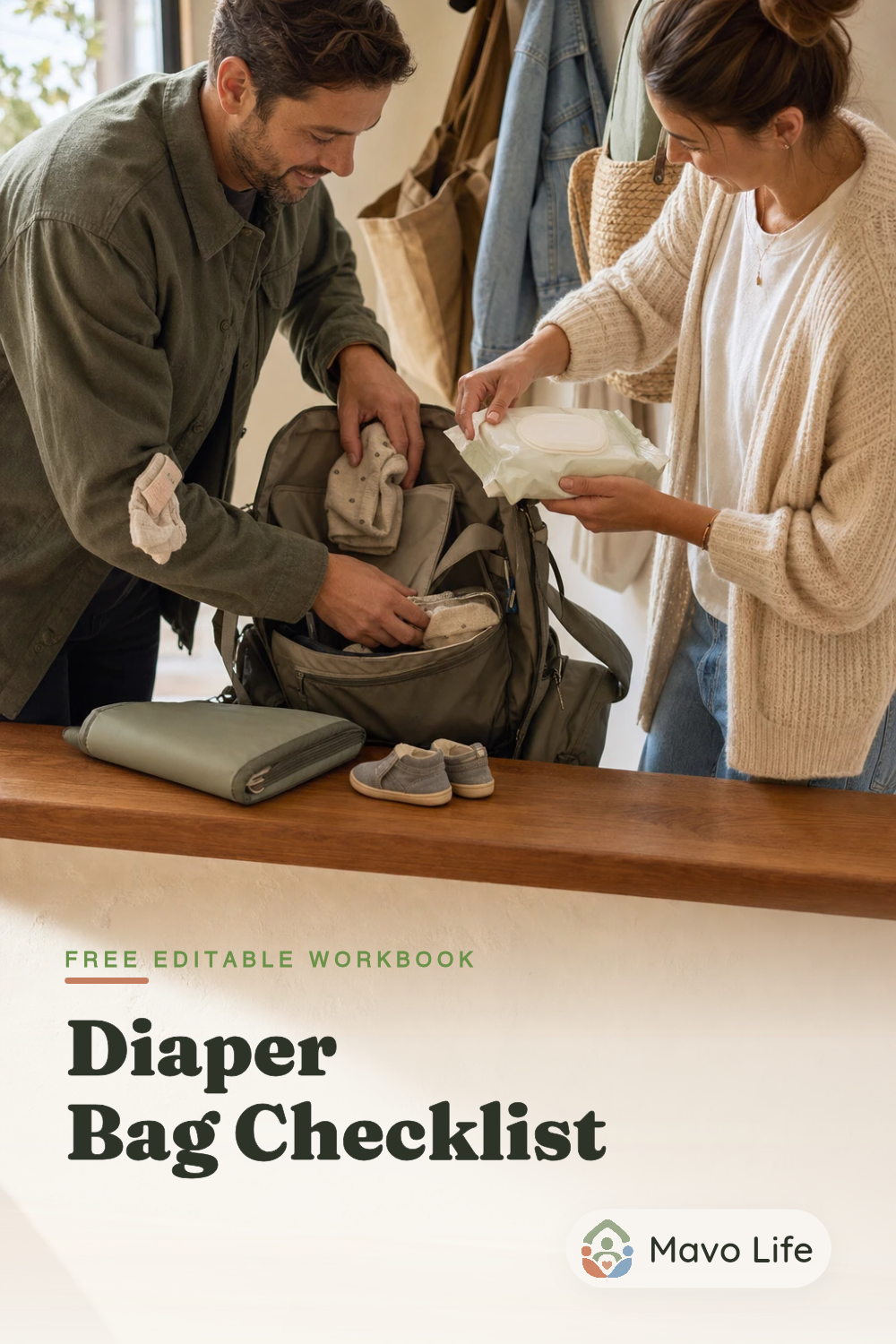 Two adults reset an open diaper bag on an entryway bench above the words Free Editable Workbook and Diaper Bag Checklist.